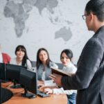 How is your deals. Group of people at business conference in modern classroom at daytime